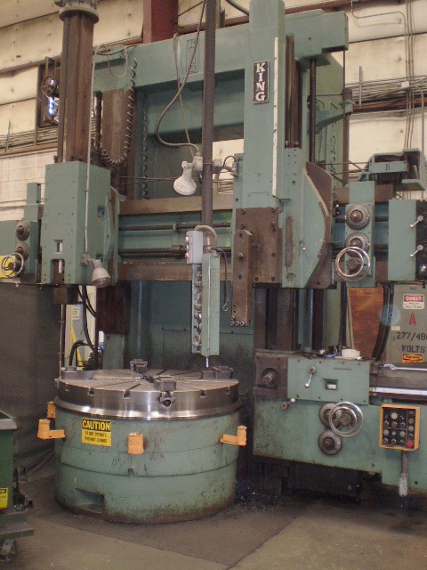 56" KING 3 HEAD VTL, 2 RAM HEADS ONE A LIVE SPINDLE, SIDE HEAD, 4 JAW CHUCK, EXTENDED COLUMN