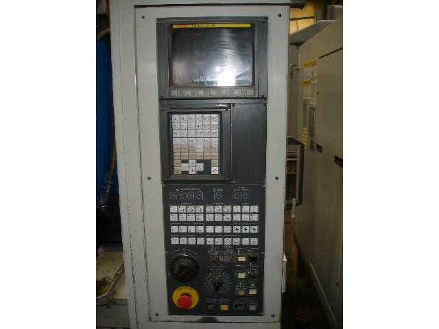 EXCEL PMC-5T18 VERTICAL MACHINING CENTER, Fanuc 21M CNC Control With Monitor. Handwheel Jog. Keyboard RS232 Port. 3.5" Floppy Drive. Rigid Tapping. 18-Position Automatic Tool Changer. Flood Coolant