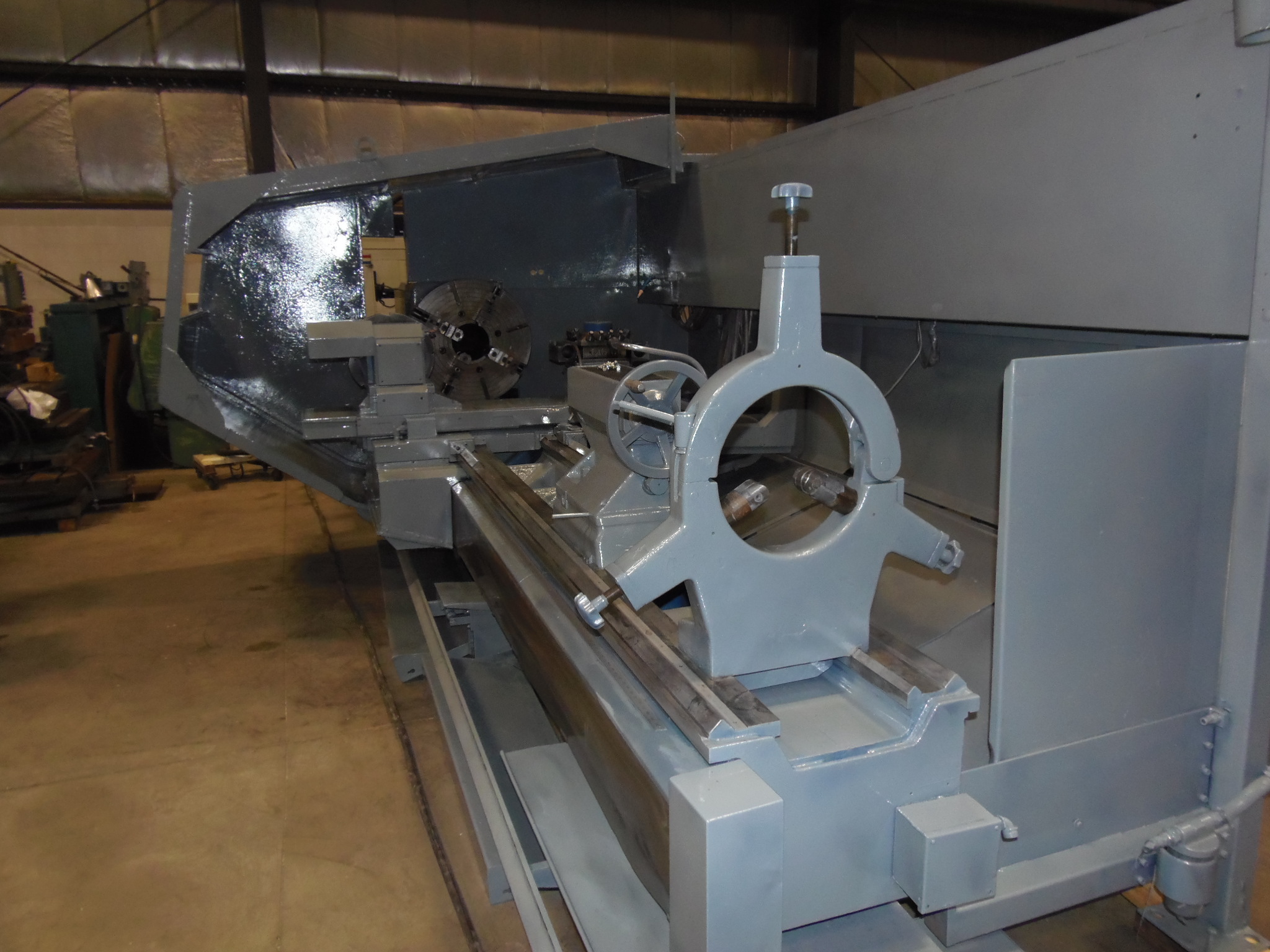 32" X 135" BEHRINGER/OLYMPIA, 8" SPINDLE HOLE, DUAL CHUCKS, FANUC 18T CONTROL, 50 HP, REBUILT/RETROFITTED IN 2000