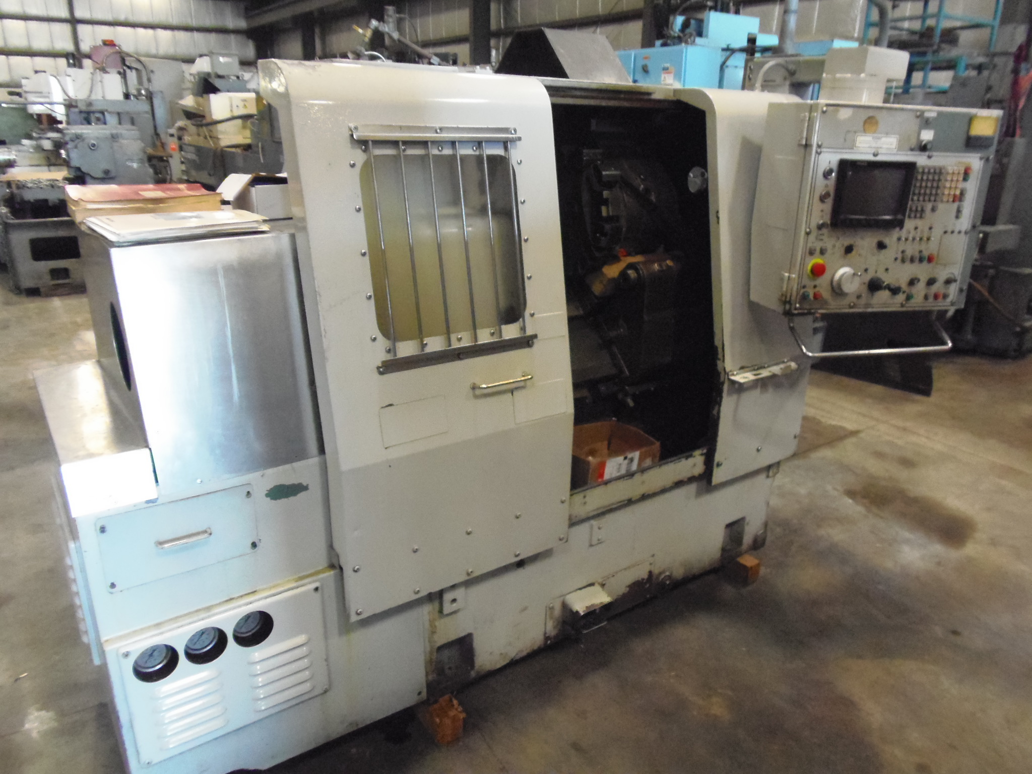 MORI SEIKI SL-1A, 16.5" SW, 12.4" CNTR, 10.8" LONG., 3.9" CROSS, 6" 3 JAW AND COLLET CHUCKS, 1.6" BORE, FANUC 11T WITH CRT
