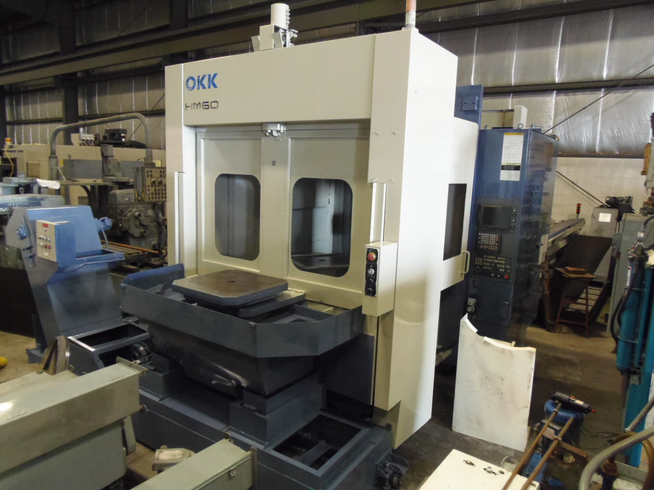 OKK HM-60, 1999, 2-24" PALLETS, FANUC 16M, CAT 50, 8,000 RPM, 60 TOOLS 31 X 28 X 31 TRAVELS, INTEGRAL SPINDLE
