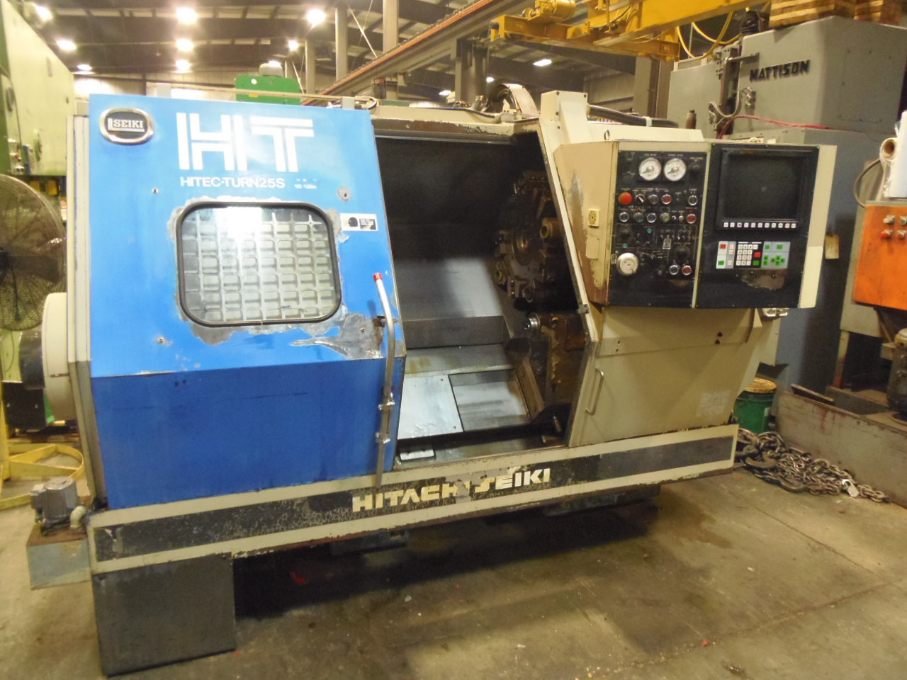 HITACHI SEIKI HT25S, YASNAC MULTI (LX3) CONTROL, 20" SWING, 23.6" CENTERS, 2.77" HOLE, CHIP CONVEYOR, 12" CHUCK, 