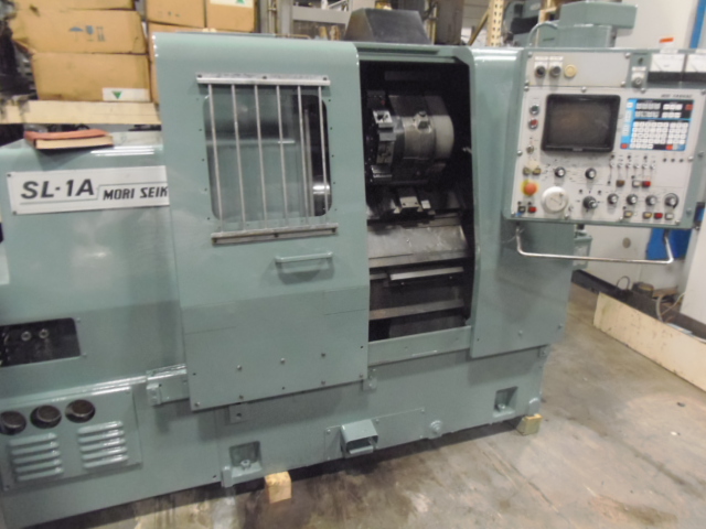 MORI SEIKI SL-1A, 6" HYD CHUCK, 12 TOOL TURRET, YASNUC LX-1 CONTROL WITH CRT, CHIP CONVEYOR