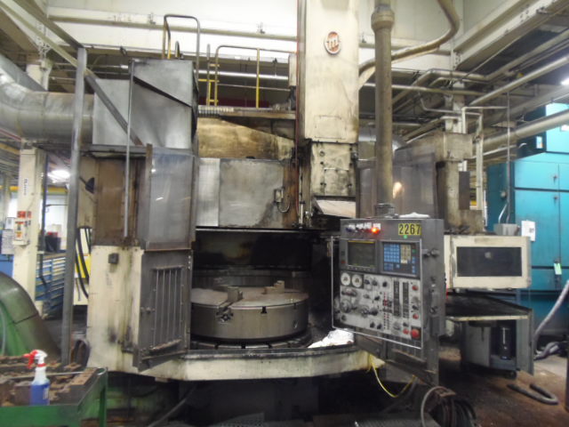 63" O-M MODEL TM2-12N, VTL, CNC VERTICAL BORING MILL, 12 ATC, FANUC 15T, 50 HP, 47" 3 JAW CHUCK, 350 RPM, 1991