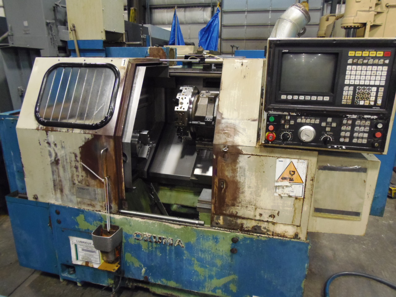 OKUMA CADET LNC-8, 8" KITAGAWA CHUCK, TAILSTOCK, 12 STATION TURRET, OSP-5020L CTRL, CHIP CONVEYOR, COOLANT