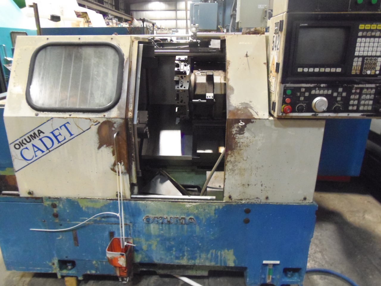 OKUMA CADET LNC-8, 8" KITAGAWA CHUCK, 12 STATION TURRET, OSP-5020L CTRL, CHIP CONVEYOR, COOLANT