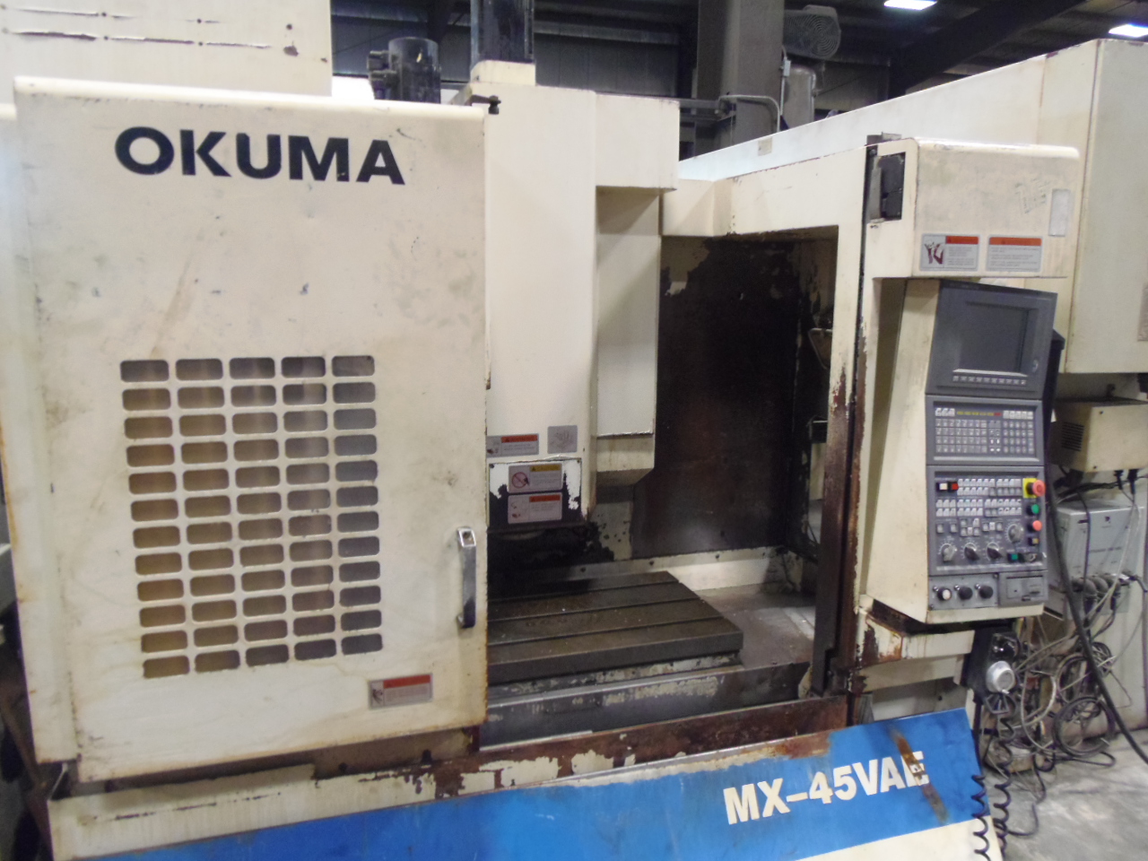 OKUMA MX-45VAE, 18 X 30 X 17 TRAVELS, OSP700M, 7,000 RPM, CAT 40, 20 ATC, CHIP CONV., 1997